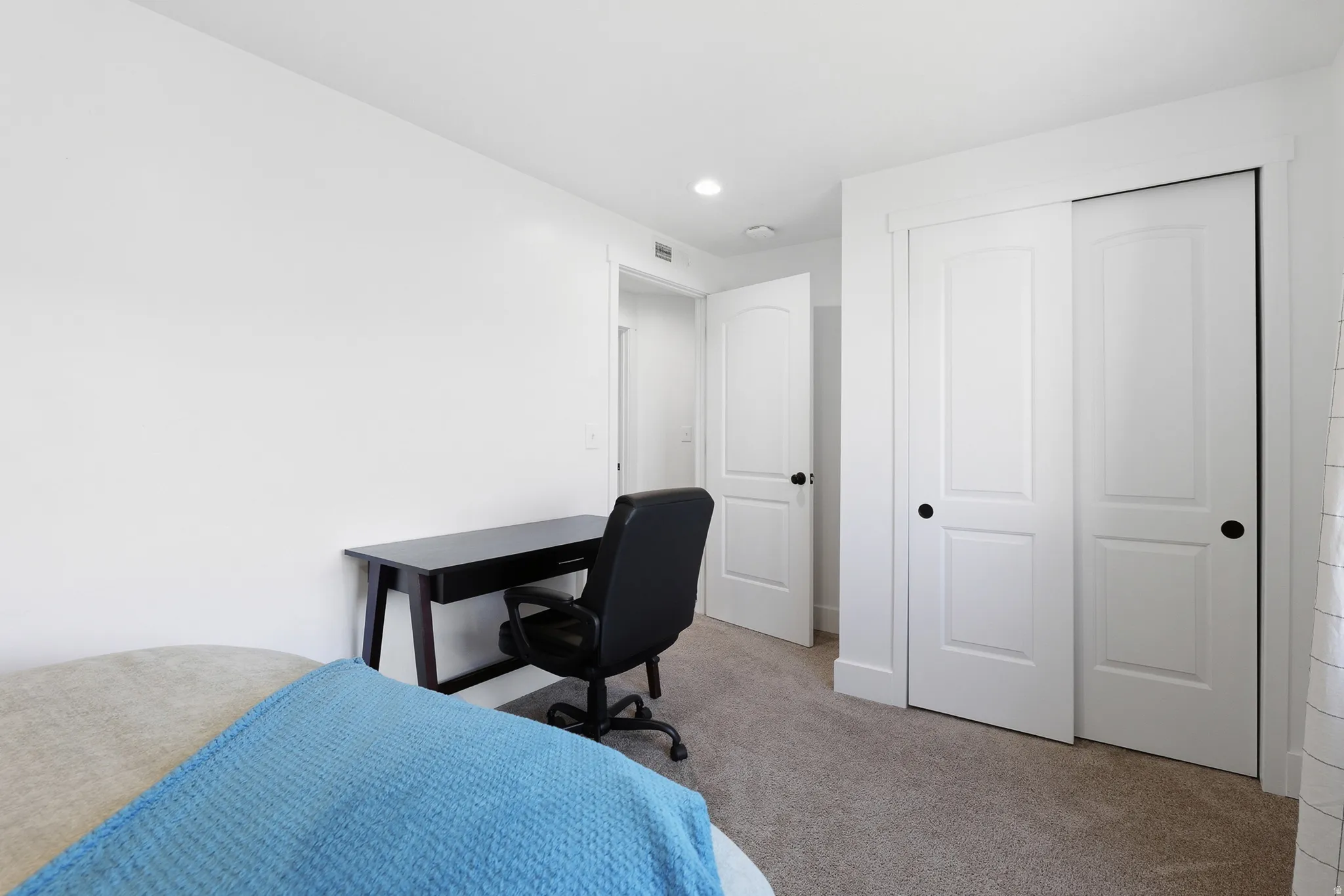 White interior with neutral carpet flooring