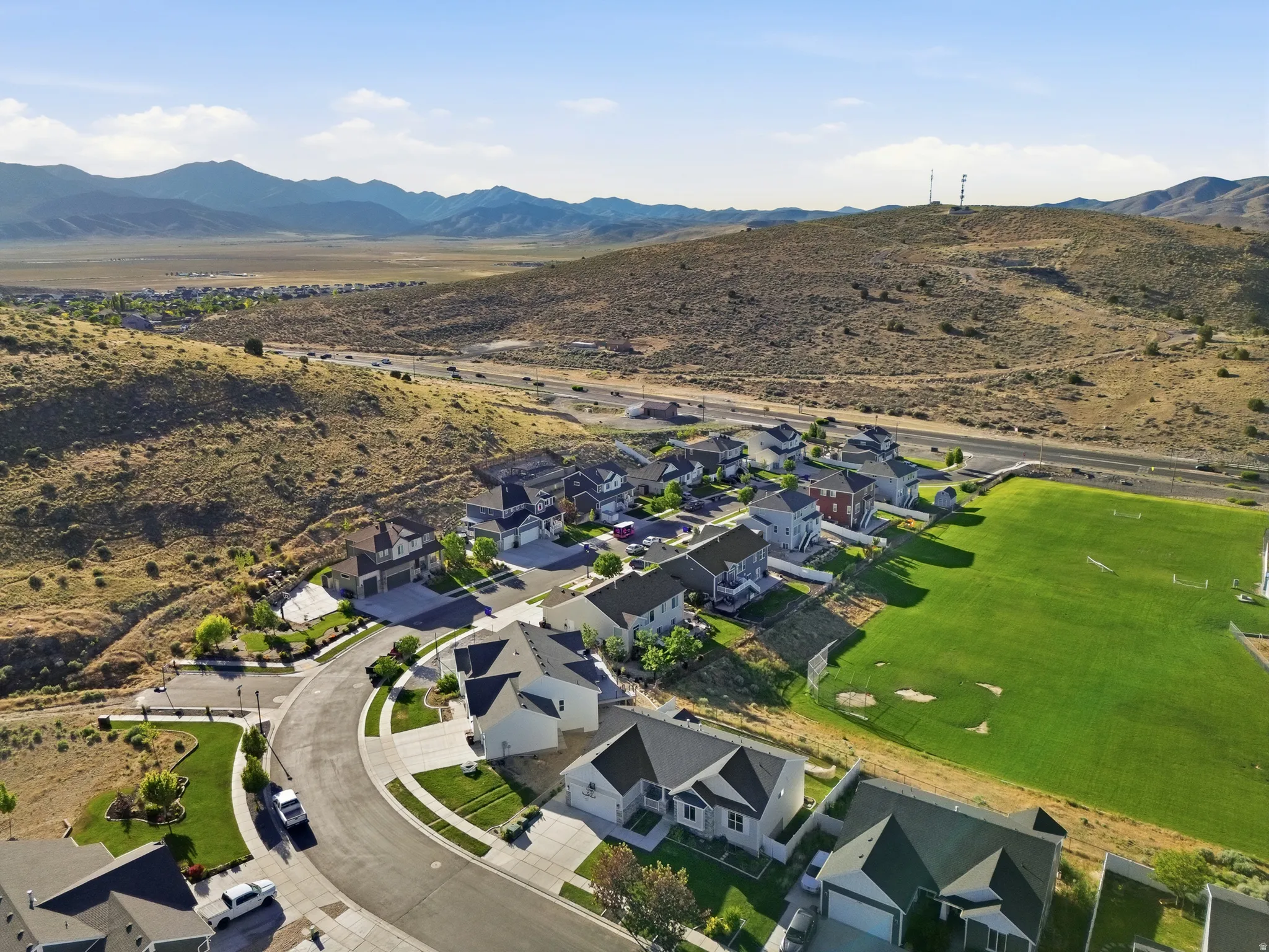Residential development featuring varied architectural styles and a manicured green space