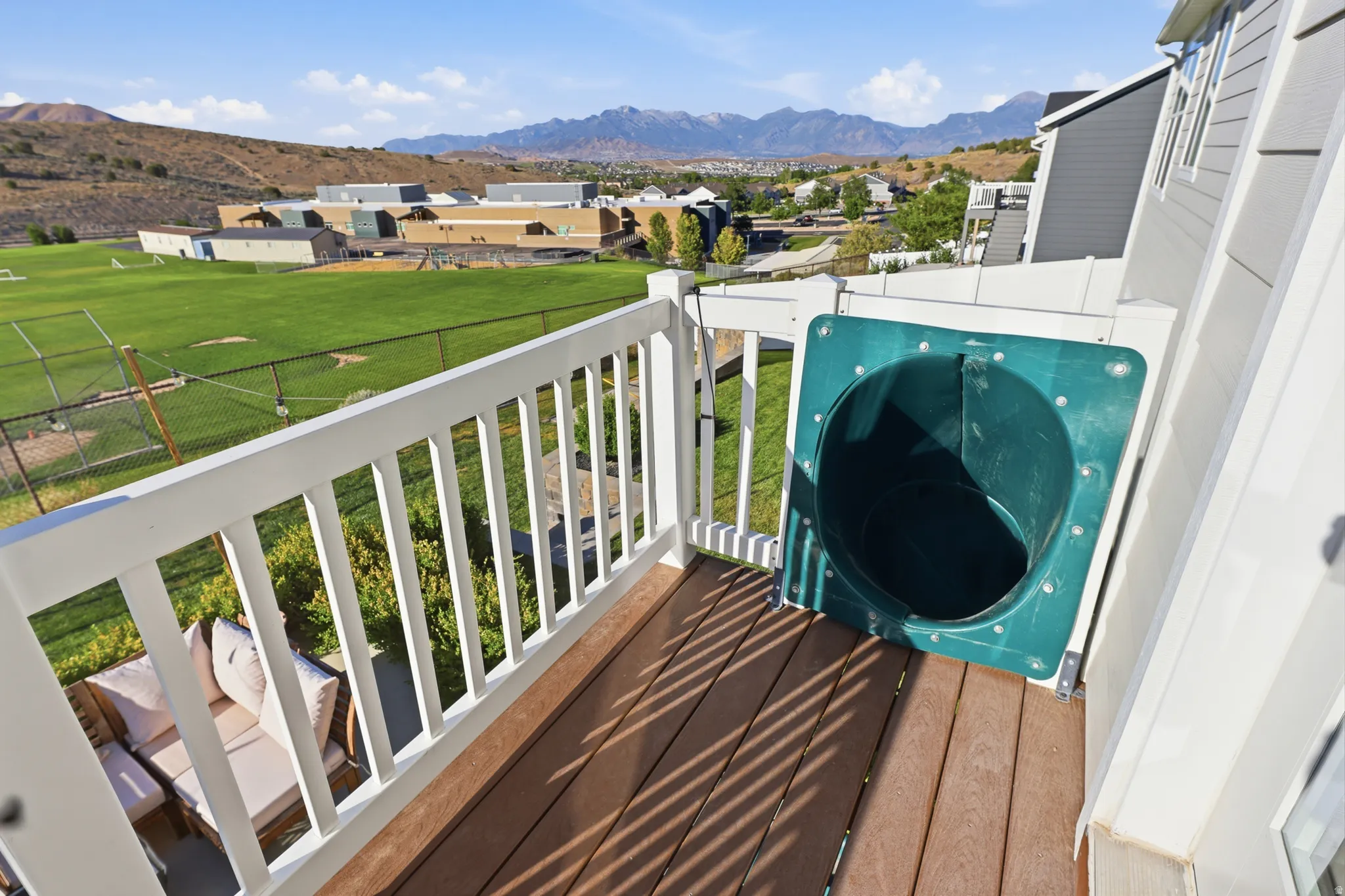 Outdoor deck featuring composite decking and white railings