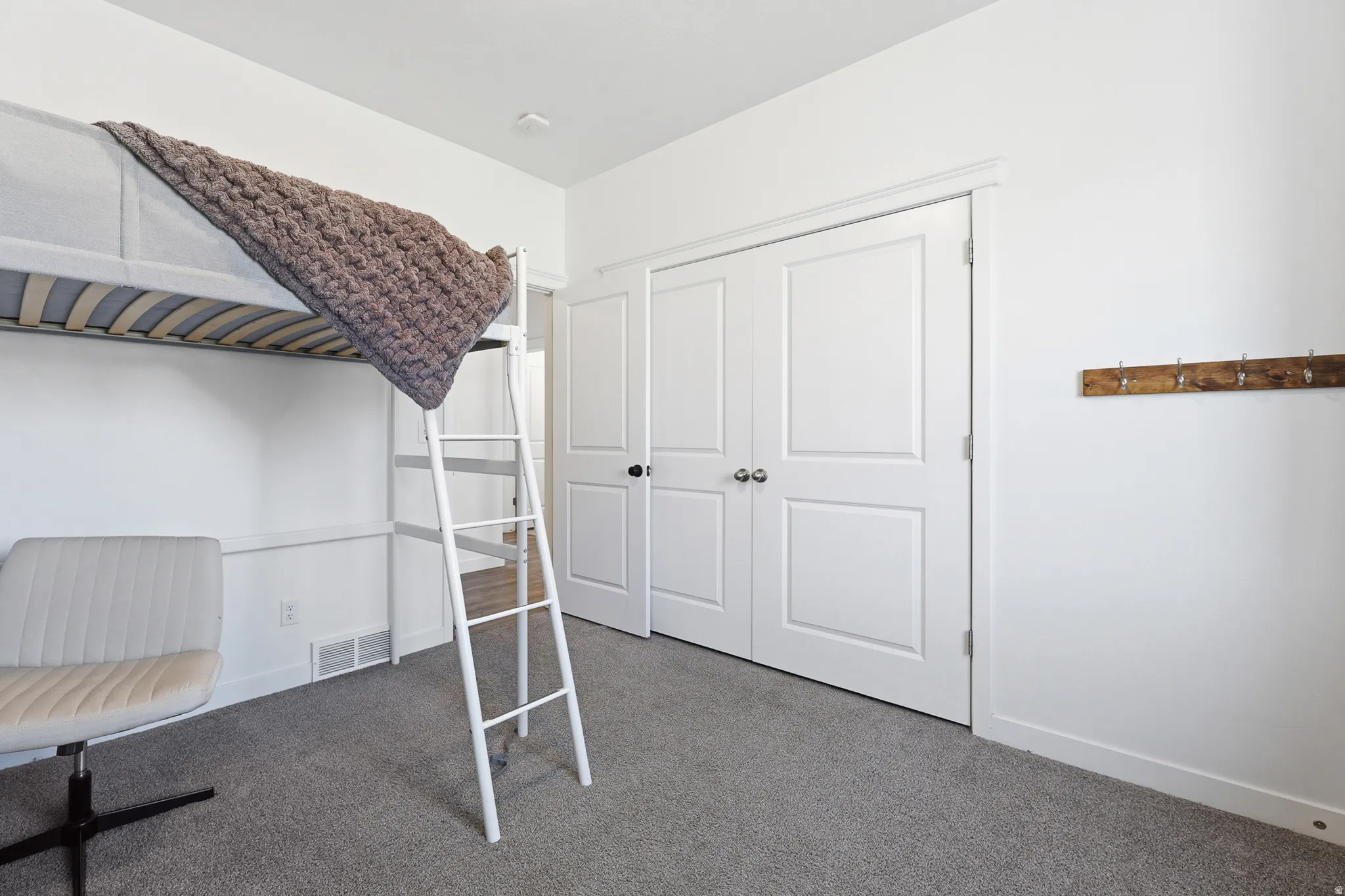 Room featuring neutral gray carpeting and white walls