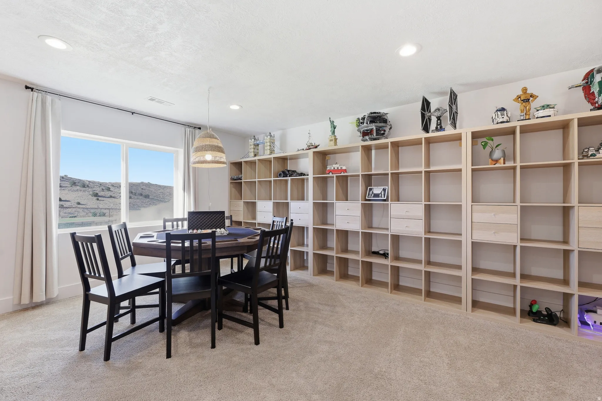 Room featuring expansive window, recessed lighting, and wall-to-wall carpeting