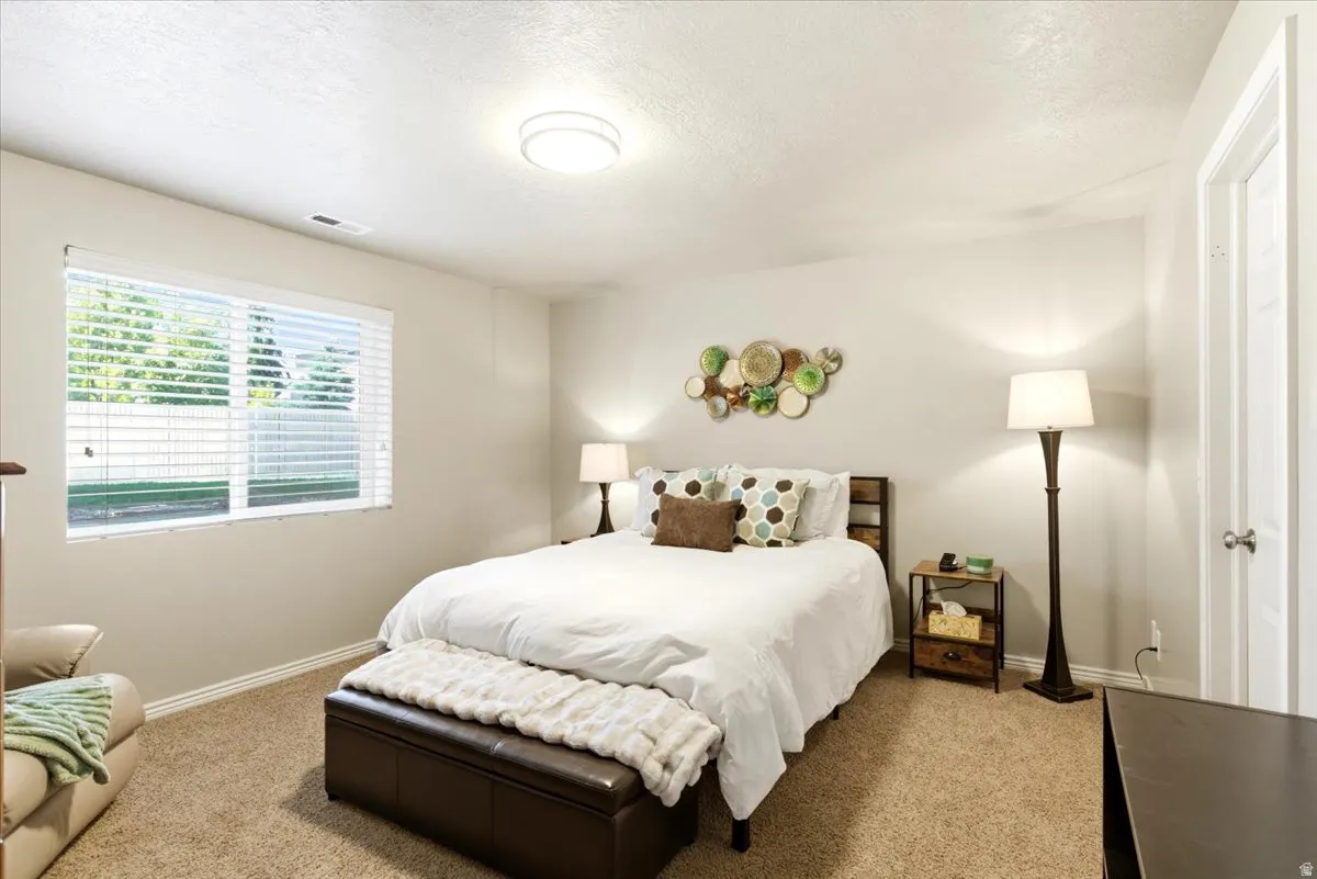 Room featuring neutral-toned walls and carpet flooring
