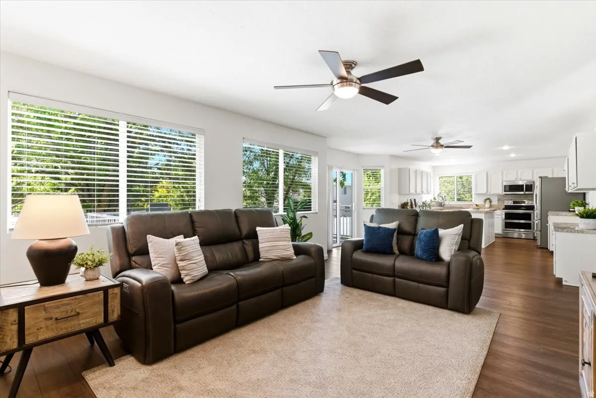 Open-concept living area featuring wood-finish flooring and a neutral color palette
