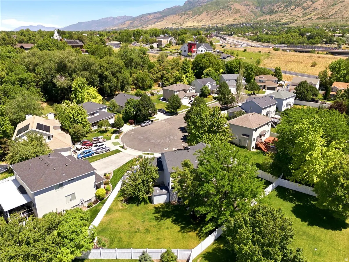 Residential neighborhood featuring varied home styles with mature landscaping