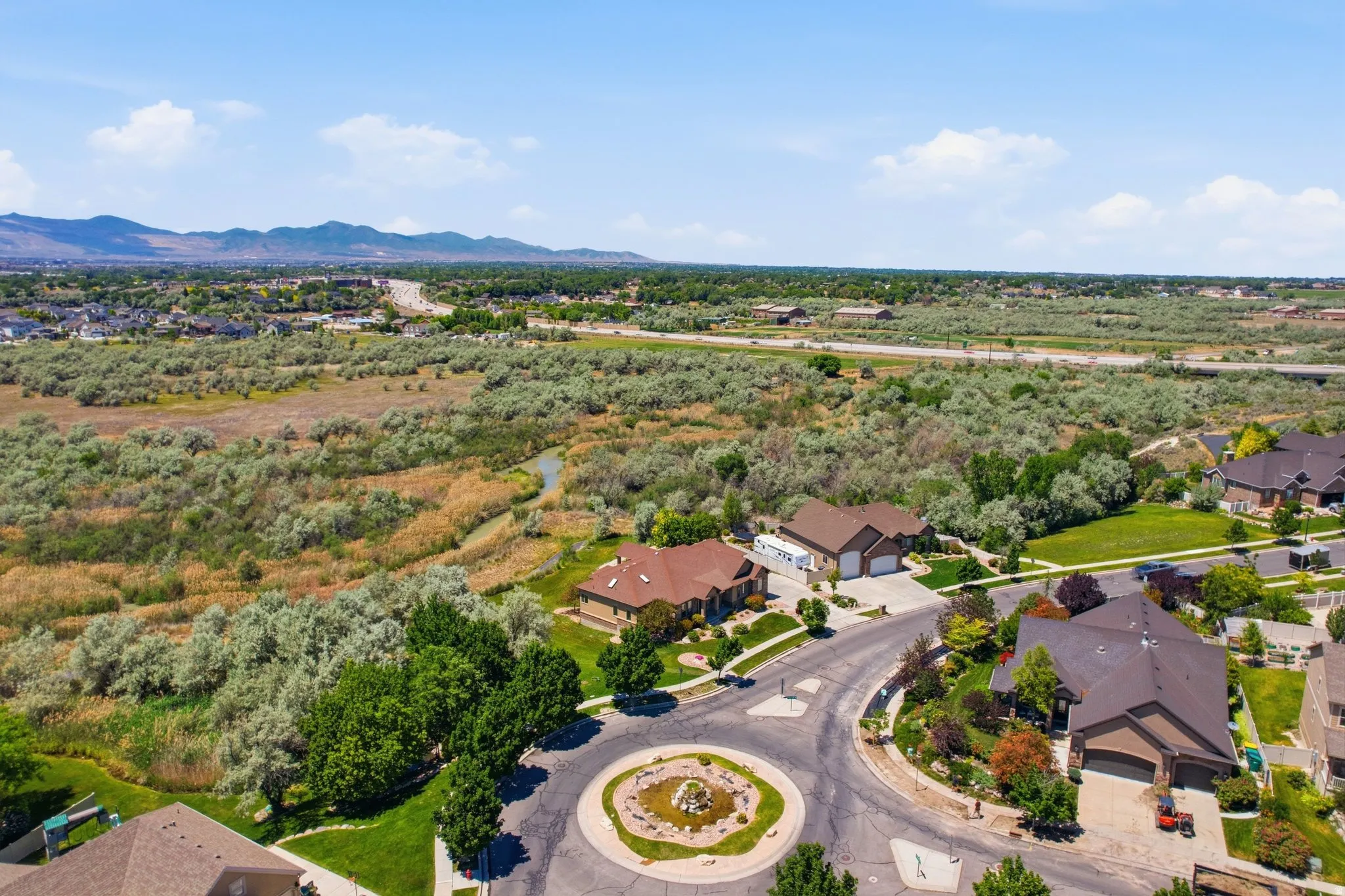 Residential area featuring a cul-de-sac and surrounding natural landscape