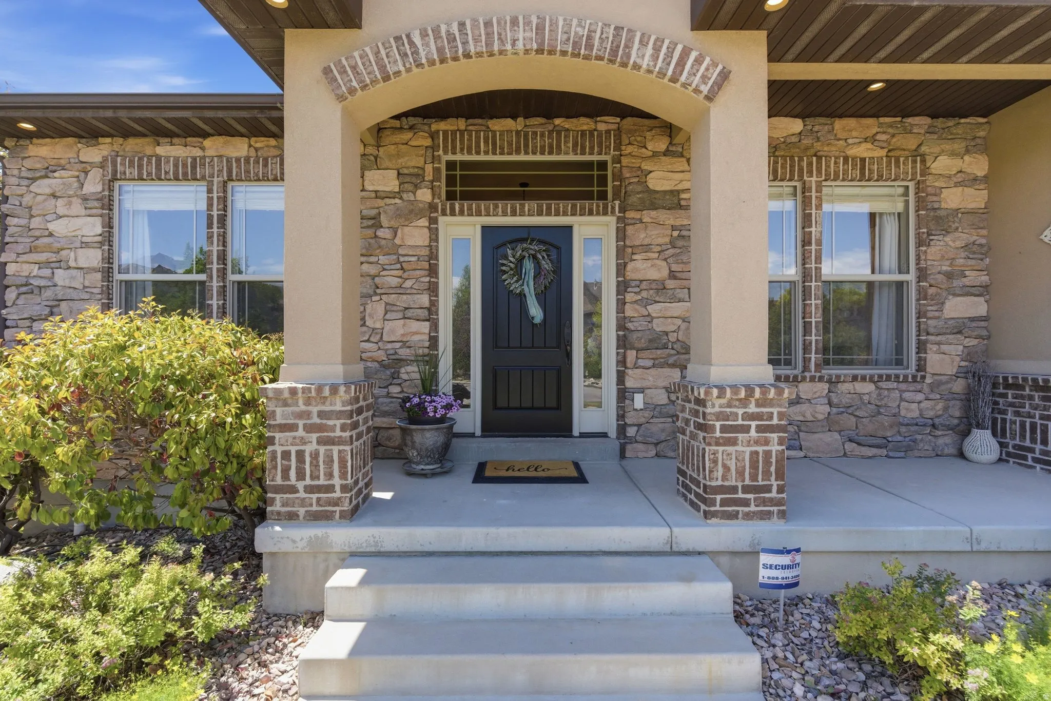 Stone and brick exterior with a prominent arched entry