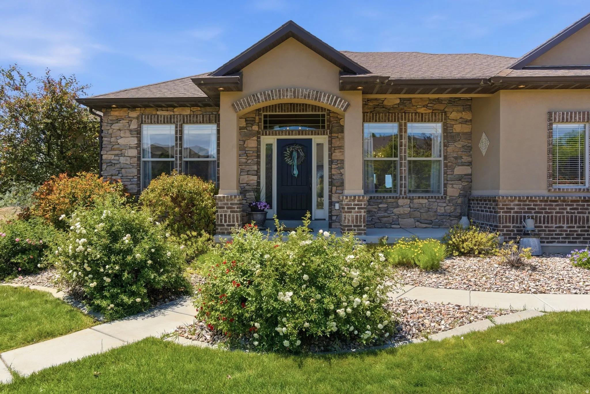 Stone and brick facade with an arched entry