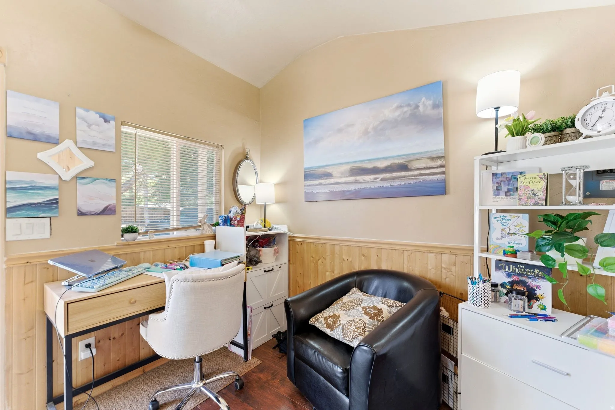 Interior room featuring wood-finish wainscoting and light-toned walls