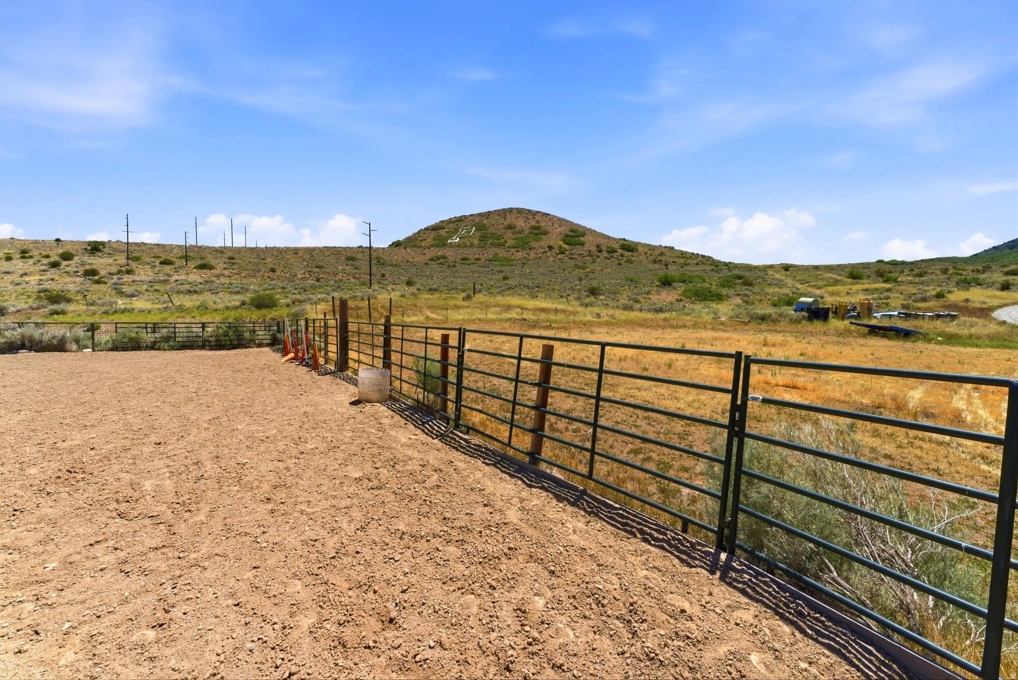 Enclosed dirt arena with metal fencing