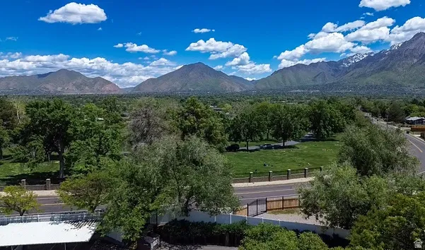 Expansive mountain range backdrop and verdant landscape