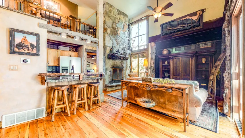 Open-concept living space with wood-finish flooring