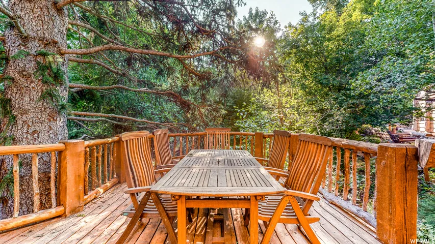 Expansive wood-finish deck with a natural wood railing