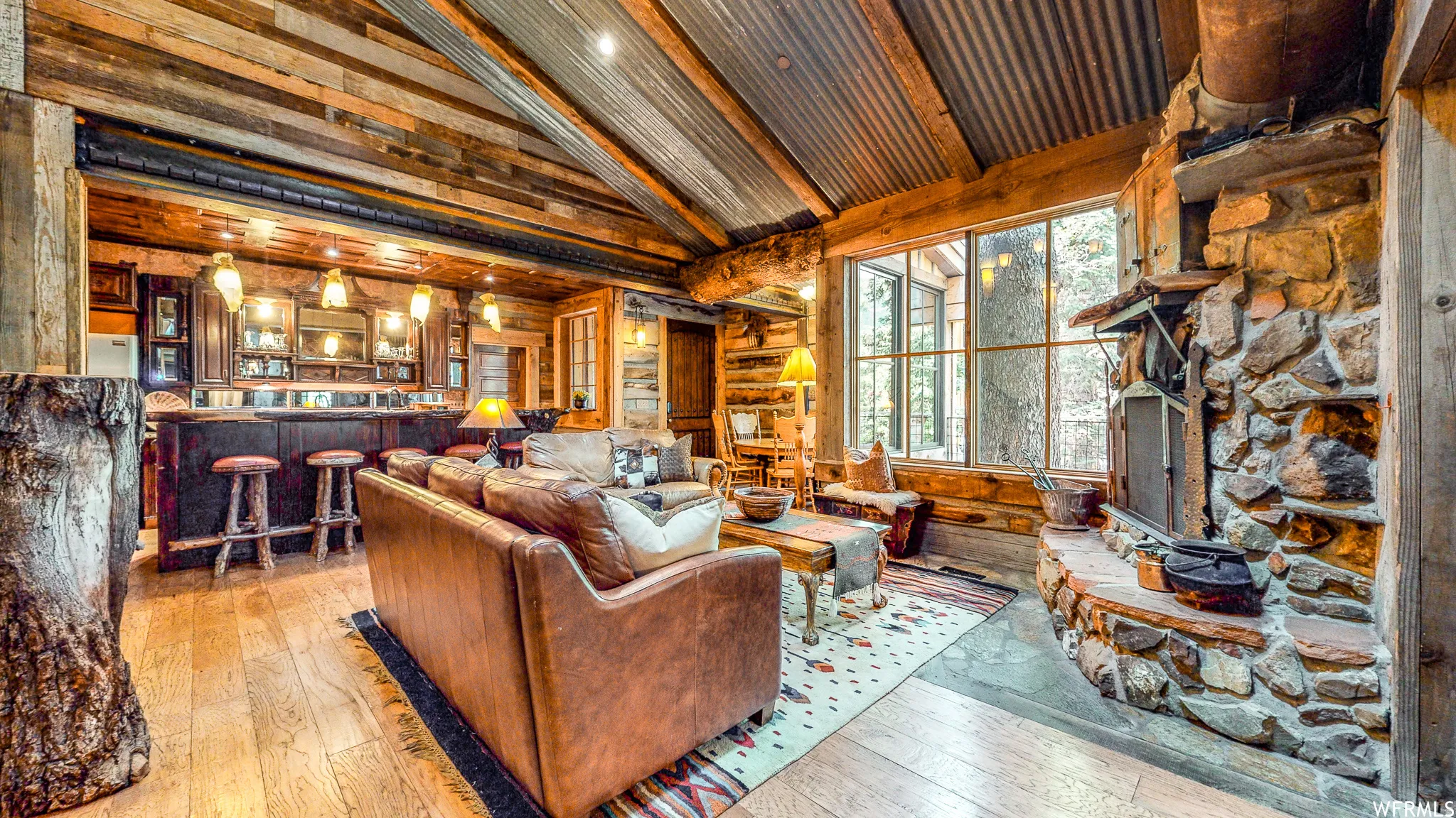 Vaulted corrugated metal ceiling with exposed wood beams