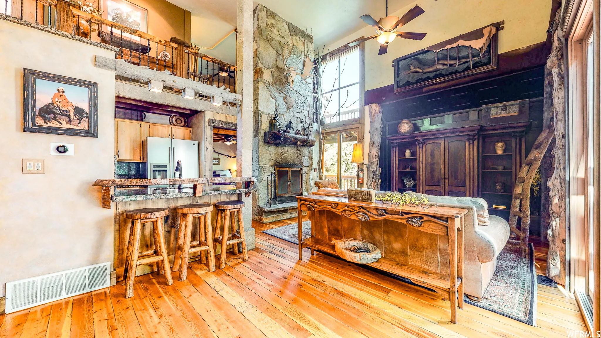 Open-concept living space with wood-finish flooring