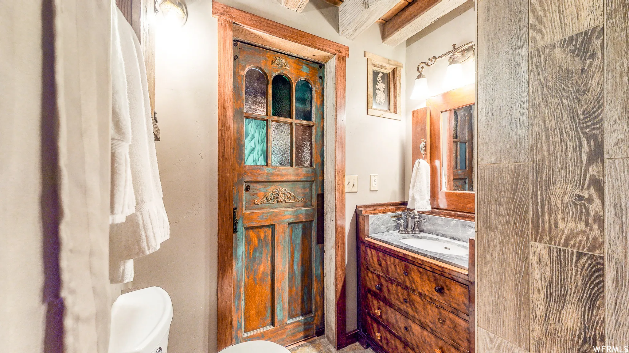 Custom wooden door with stained glass accents