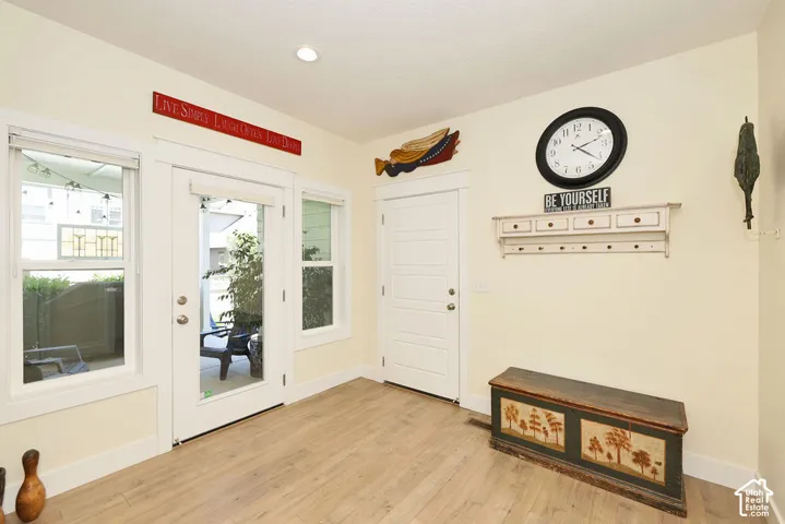 Light wood-finish flooring complements a neutral wall color