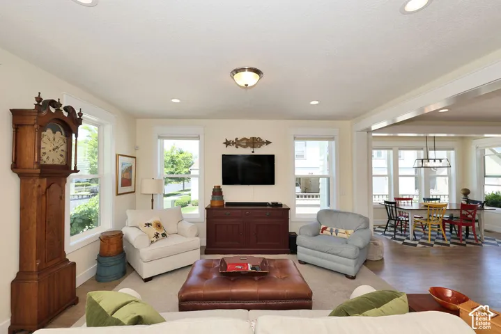 Living area featuring recessed lighting and a decorative ceiling fixture