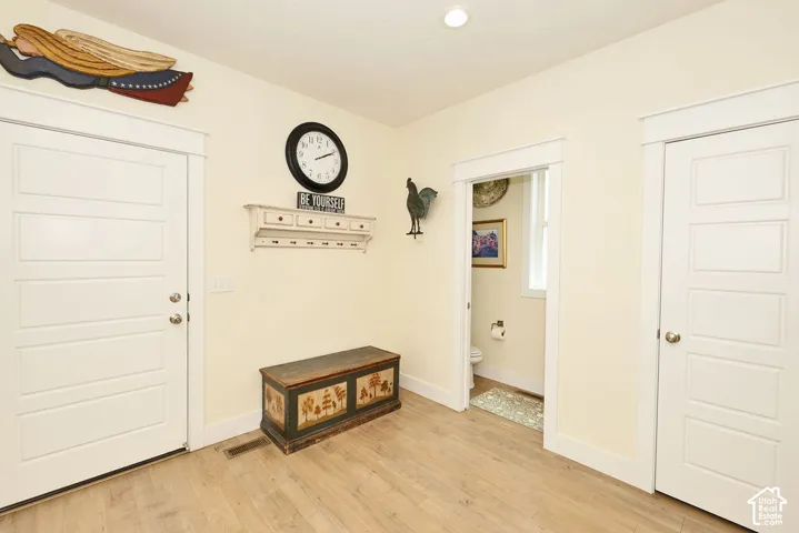 Light wood-finish flooring complements creamy wall tones