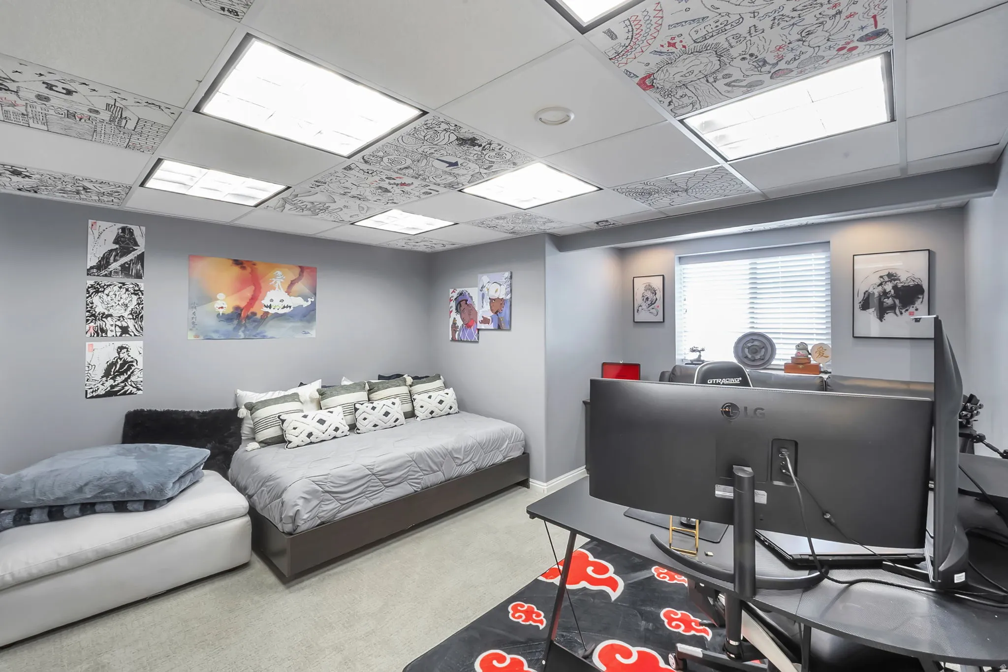 Room featuring overhead panel lighting, light gray wall paint, and light gray carpeting