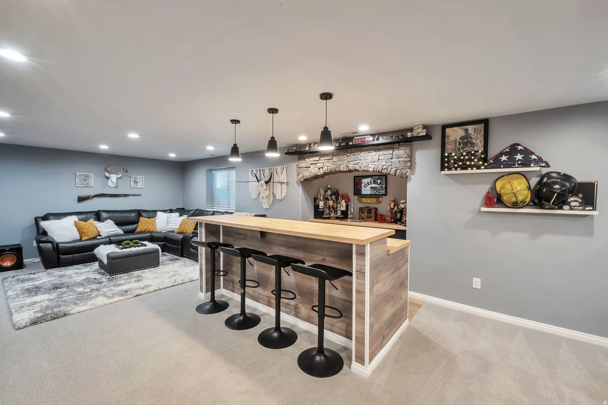 Custom bar featuring a wood-finish countertop and paneling