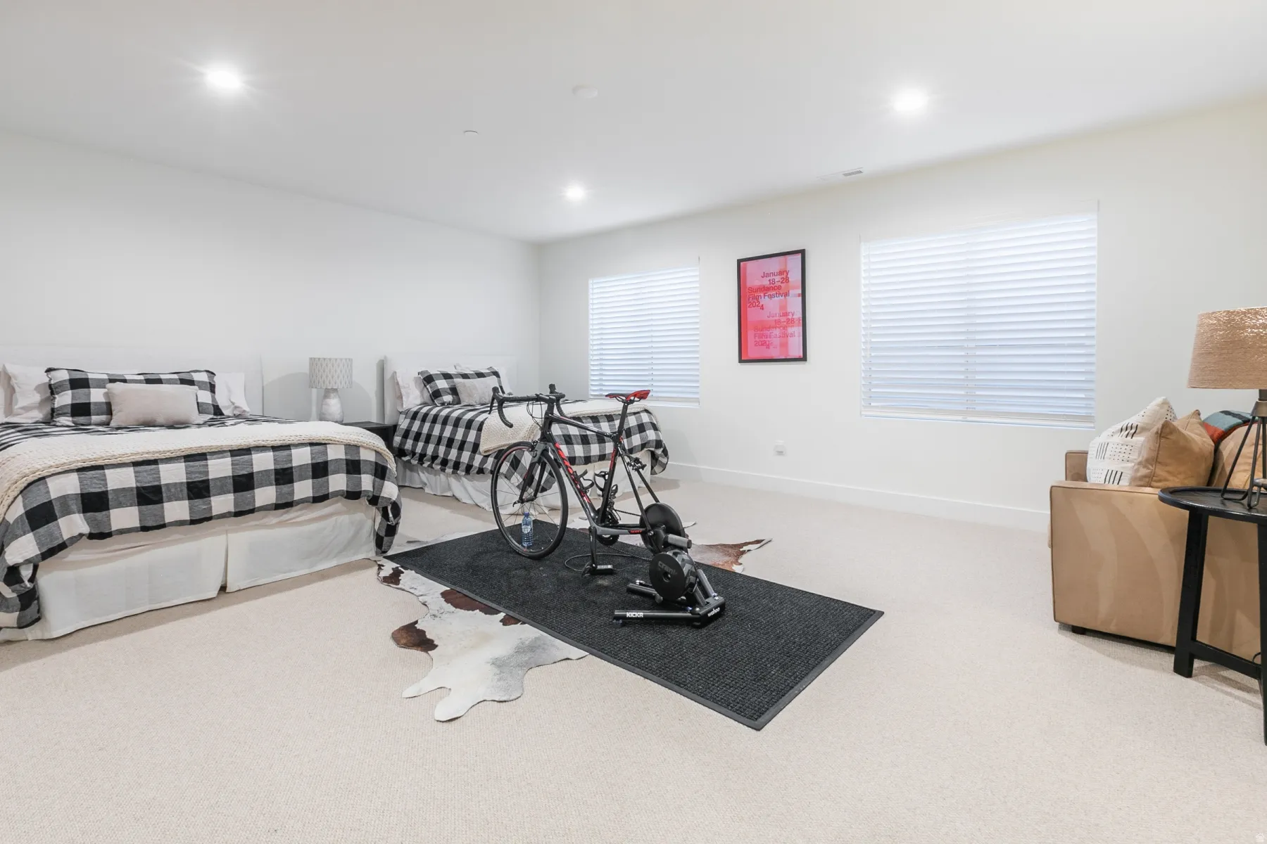 Spacious room with plush carpeting, neutral wall finishes, and recessed lighting