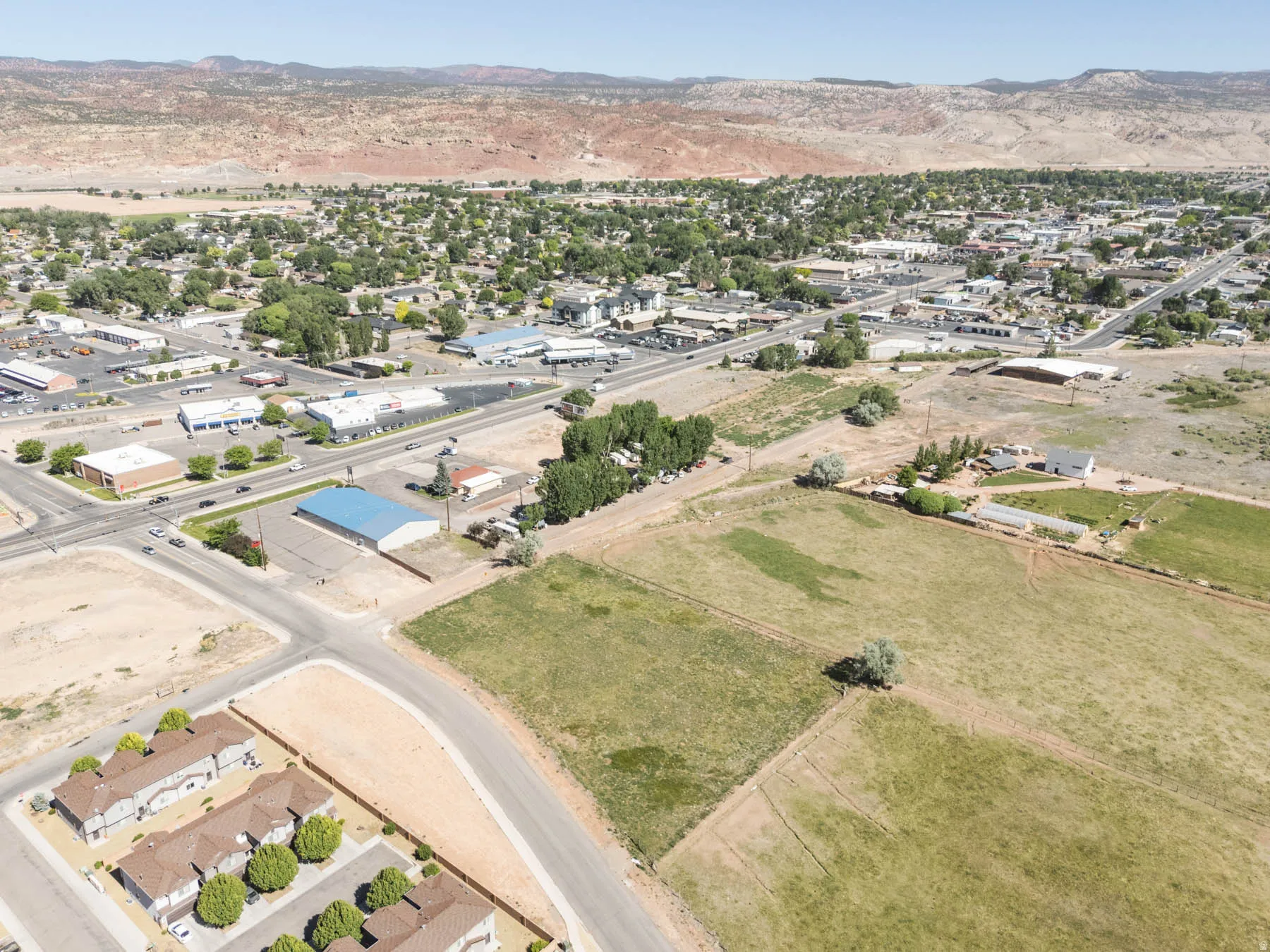 Expansive aerial view showcasing a large undeveloped parcel of land