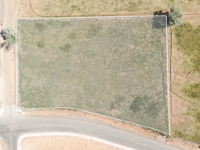 Expansive parcel featuring a large, level lot with road frontage
