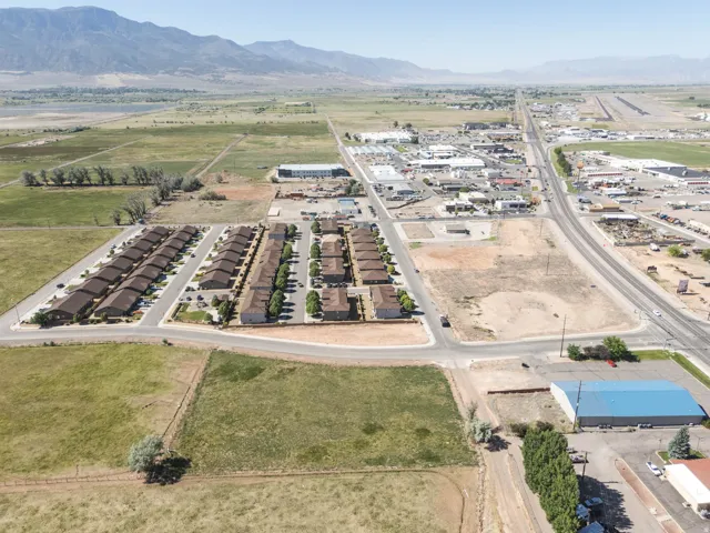 Residential development featuring multiple single-story units with brown shingle roofs