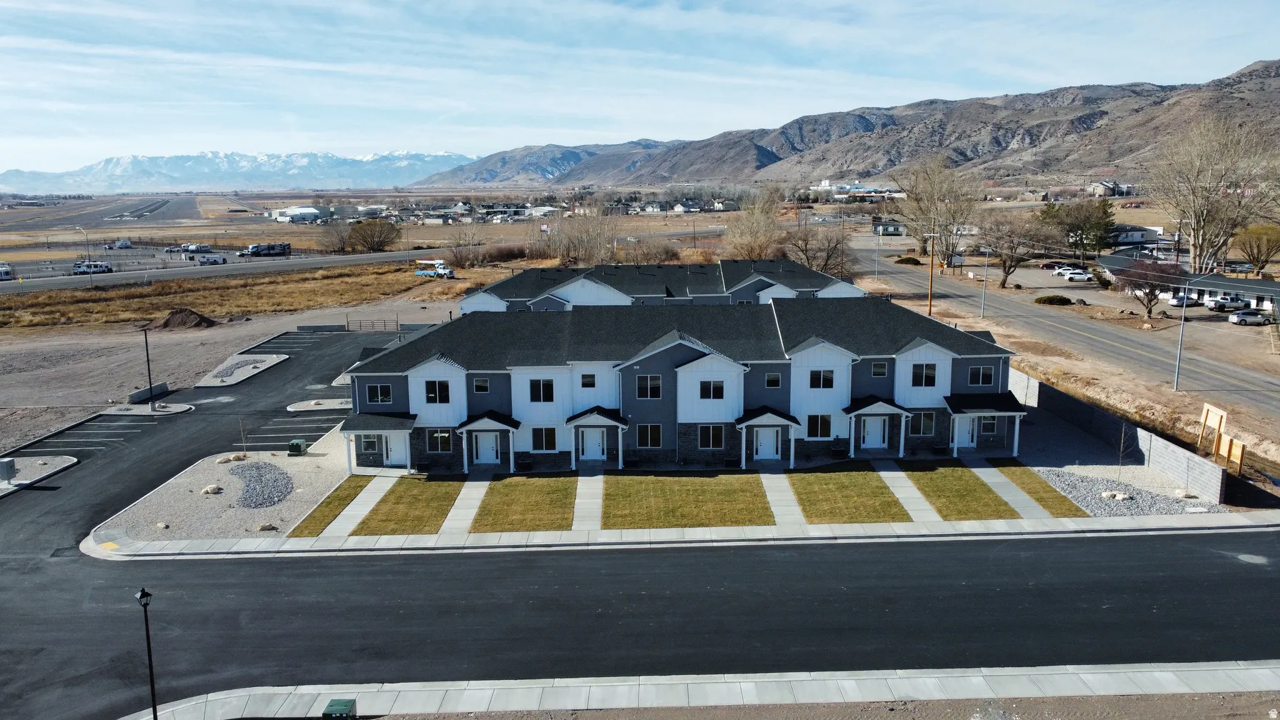 Modern townhome development featuring light and dark gray siding