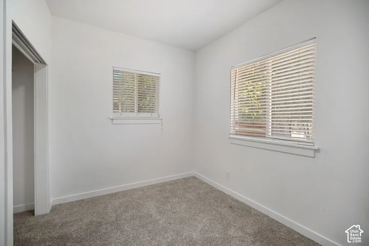 Room featuring neutral carpeting and white wall finishes