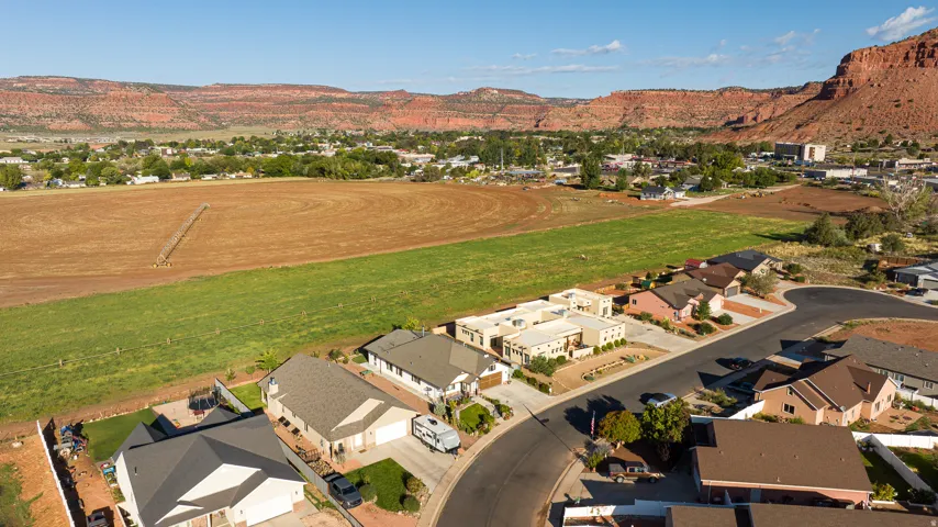 Aerial view showcasing residential properties with diverse architectural styles