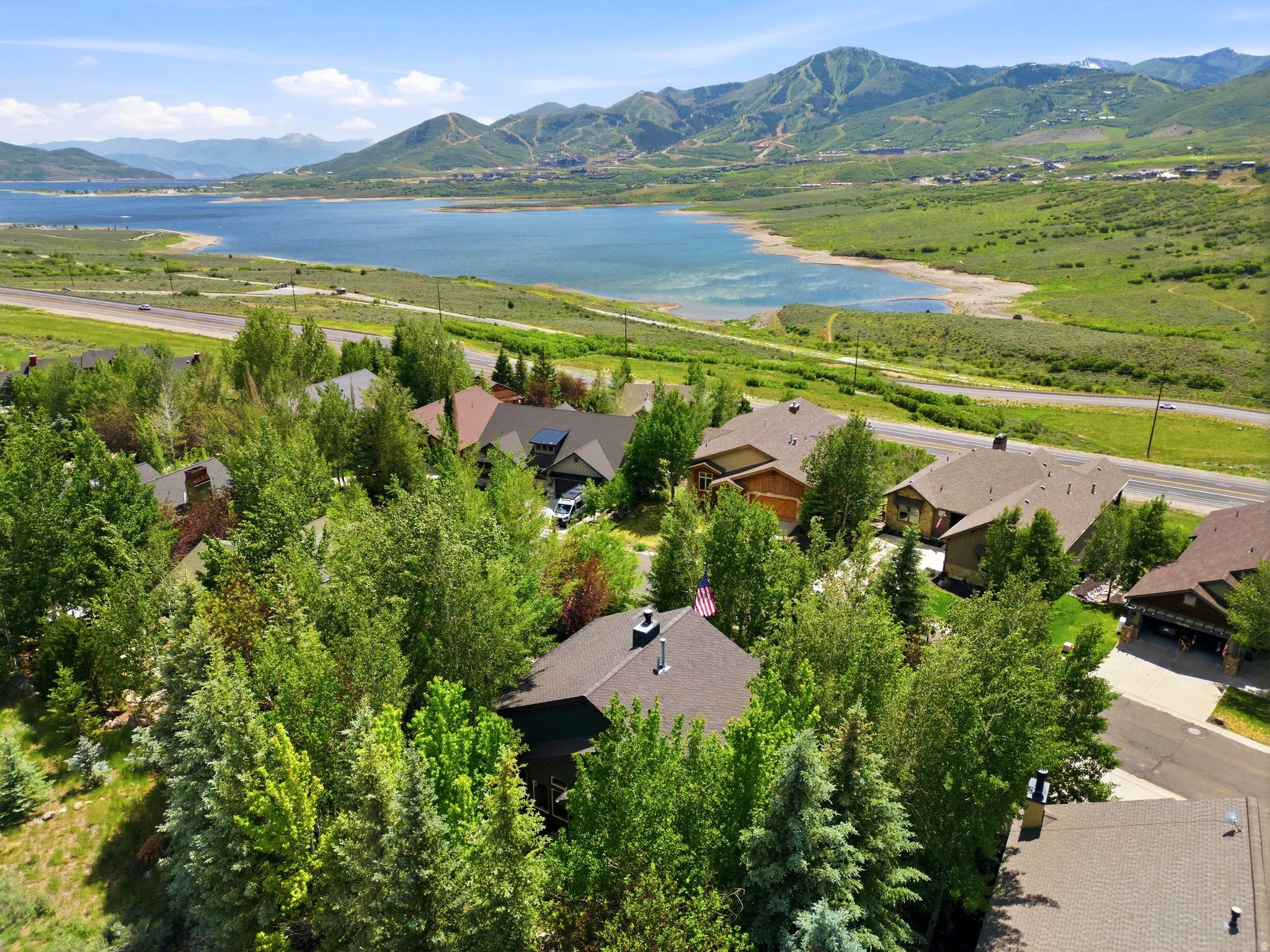 Mountain panorama with a prominent lake and surrounding green landscape