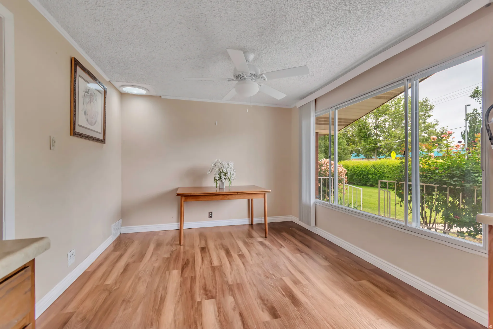 Eating area connected to kitchen with landscaping views