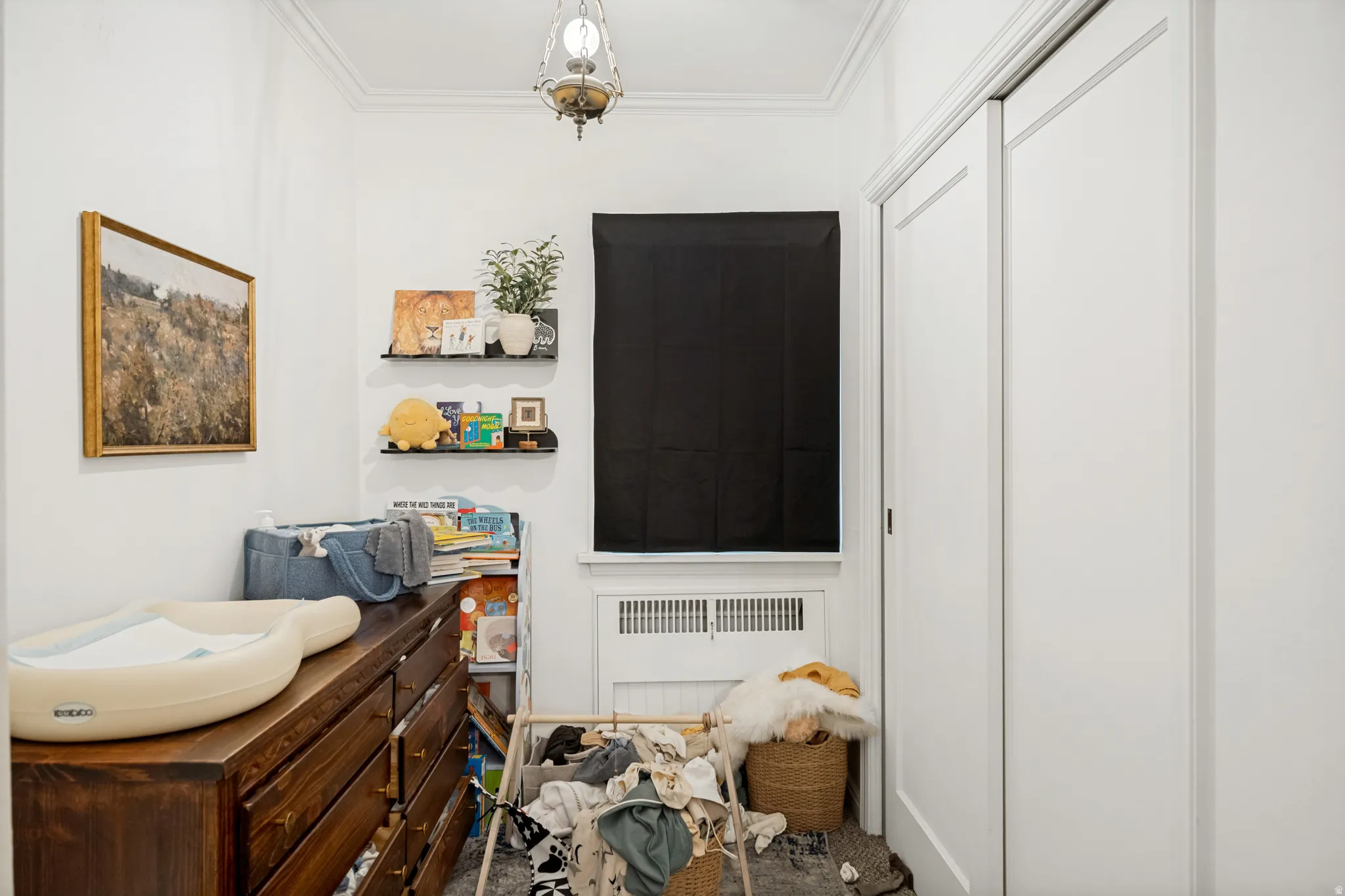 Unit 2 White painted walls with crown molding and a ceiling-mounted fixture