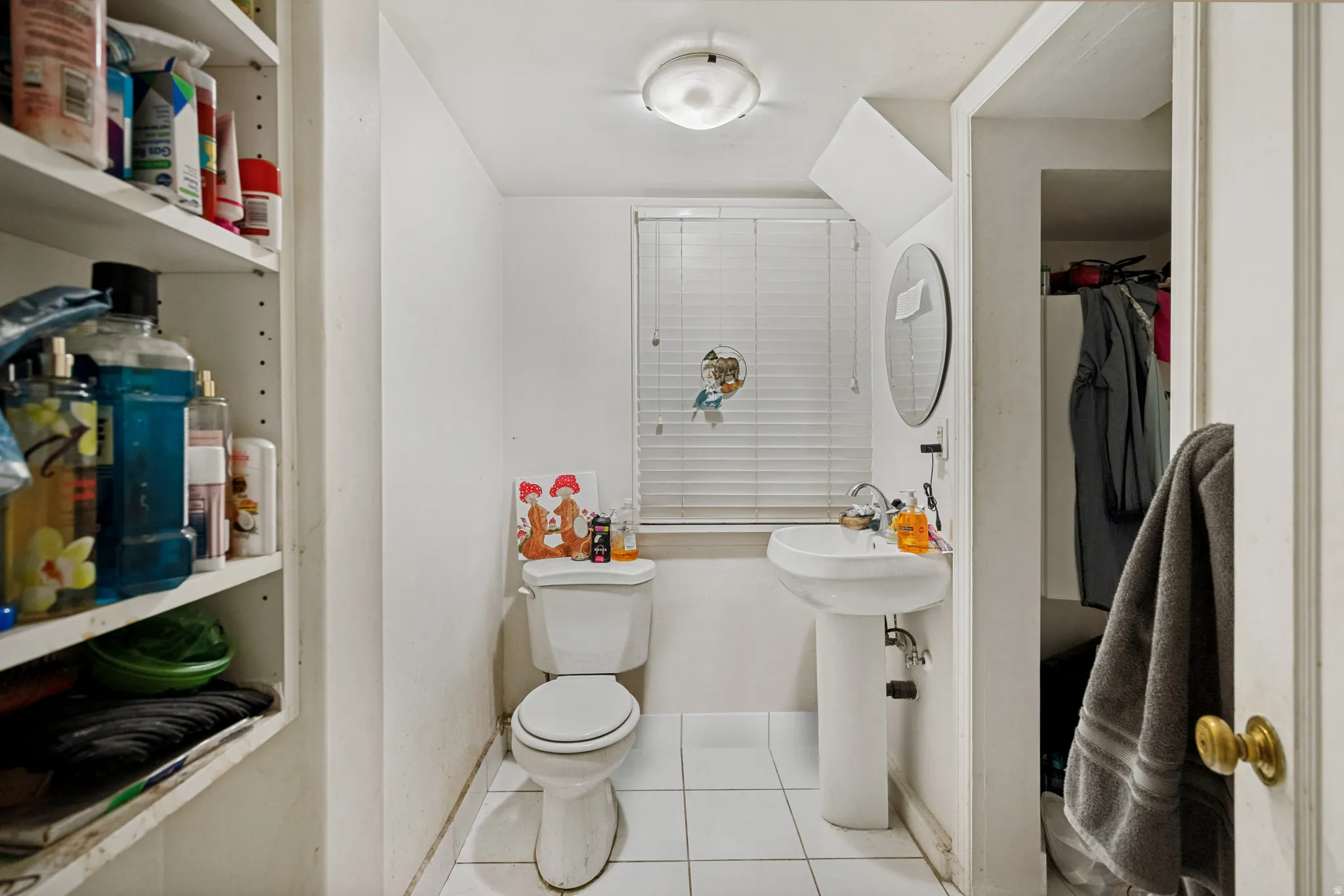 Unit 3  Bathroom featuring a pedestal sink, white toilet, and tile flooring