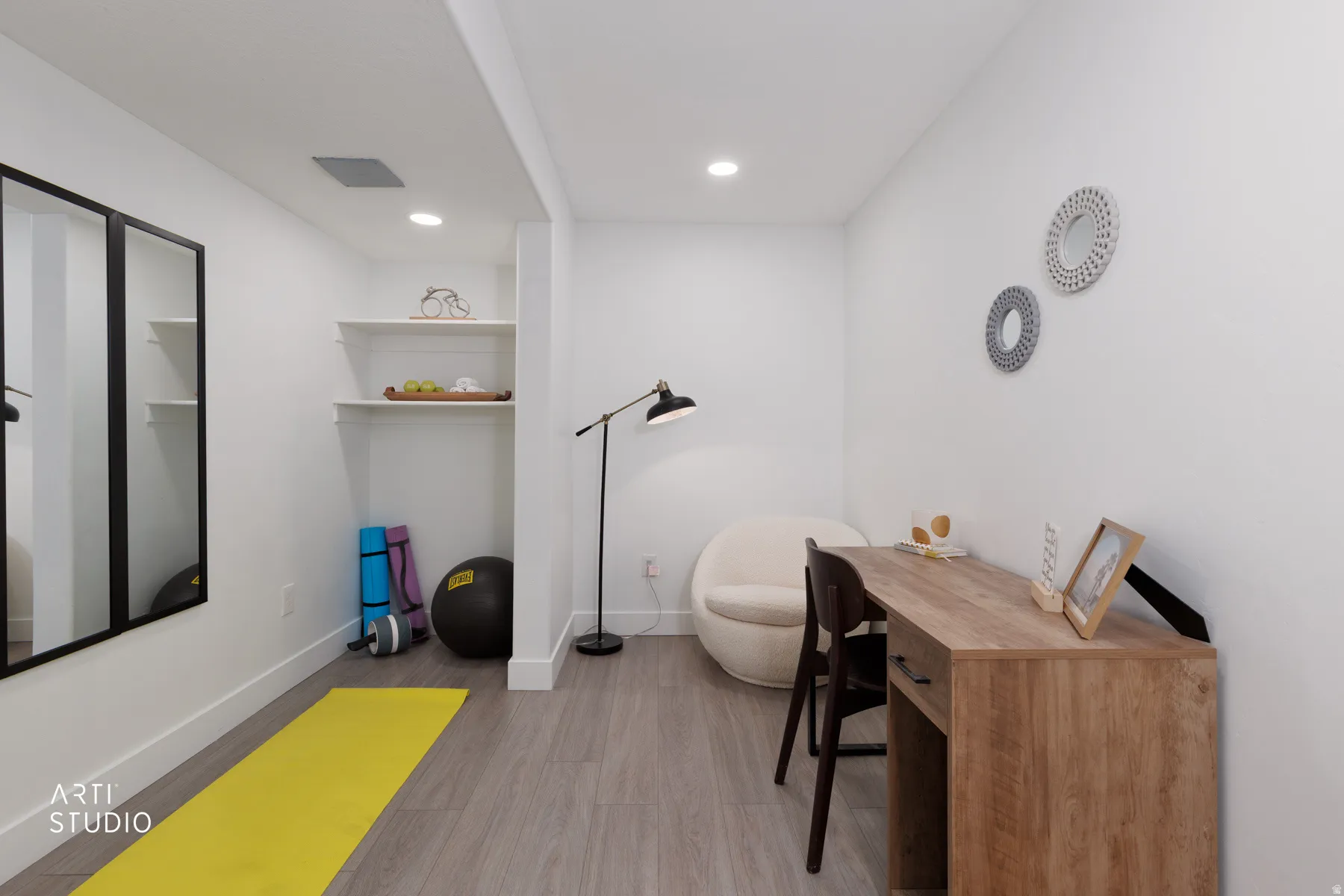Versatile room featuring wood-finish flooring, recessed lighting, and bright white walls