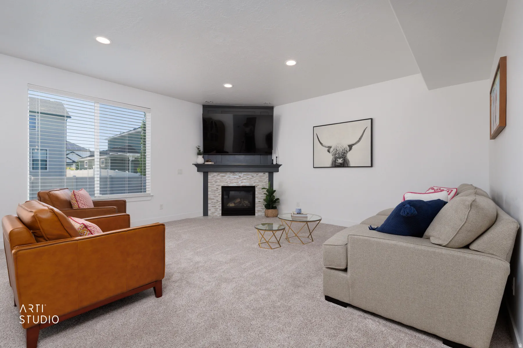 Carpeted living space featuring a tiled fireplace with a dark mantel, a large window with horizontal blinds, recessed lighting, and white walls