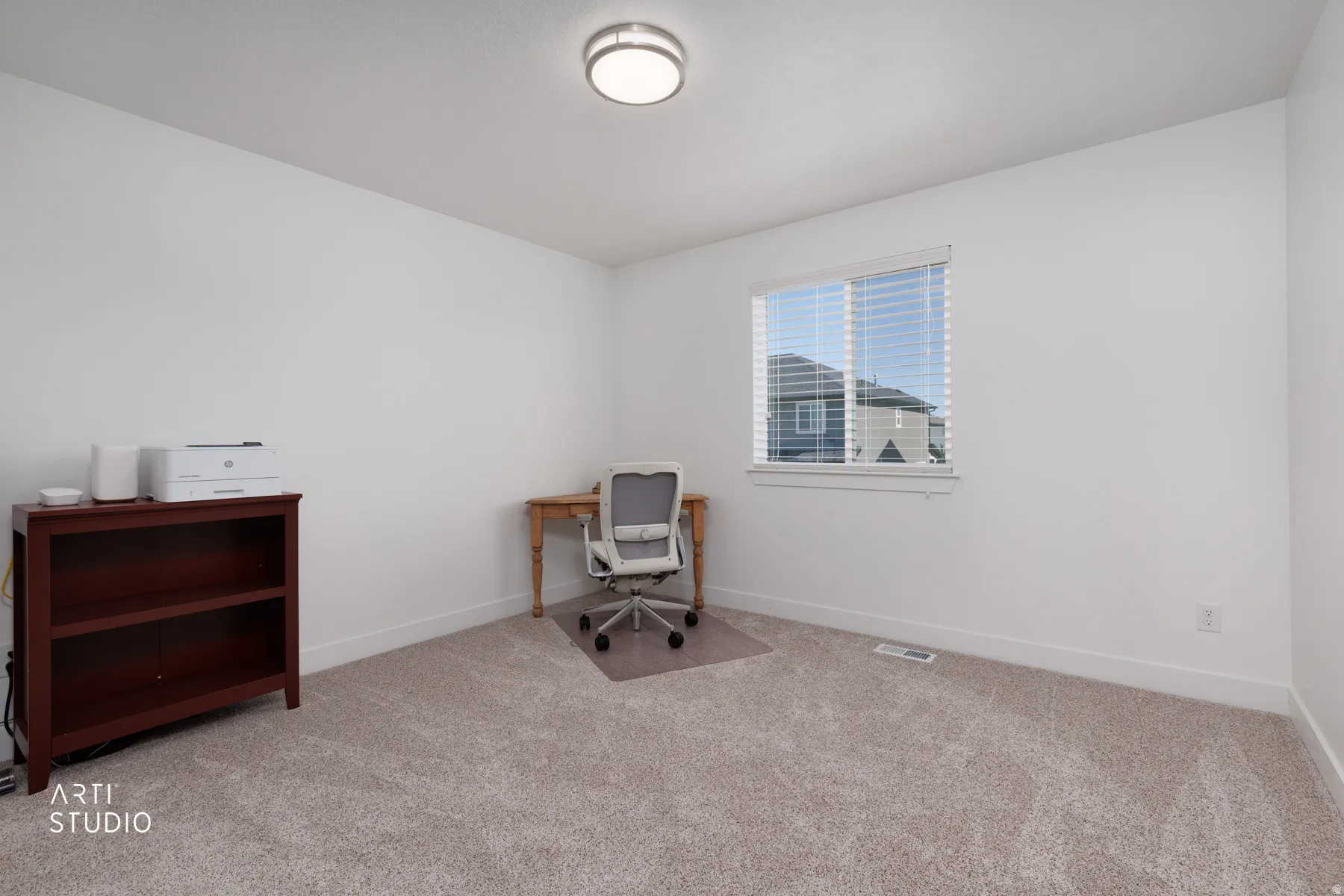 Neutral-toned carpeting complements bright white walls