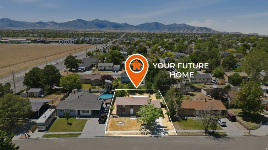 Aerial view of a residential property with a multi-story dwelling