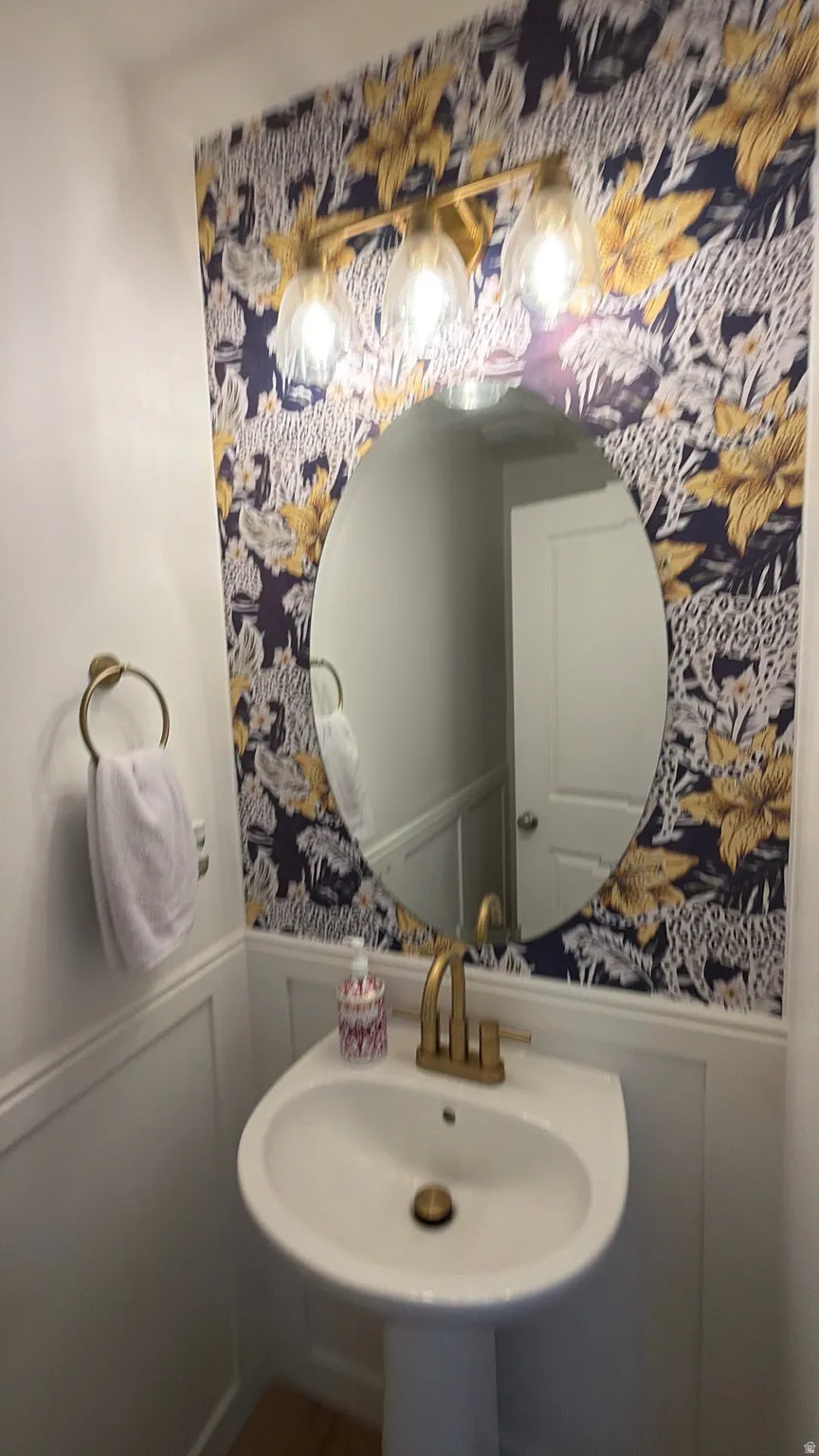 Pedestal sink with gold-finish faucet