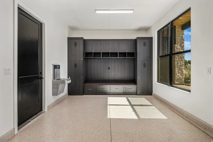Built-in dark wood-finish cabinetry and bench seating