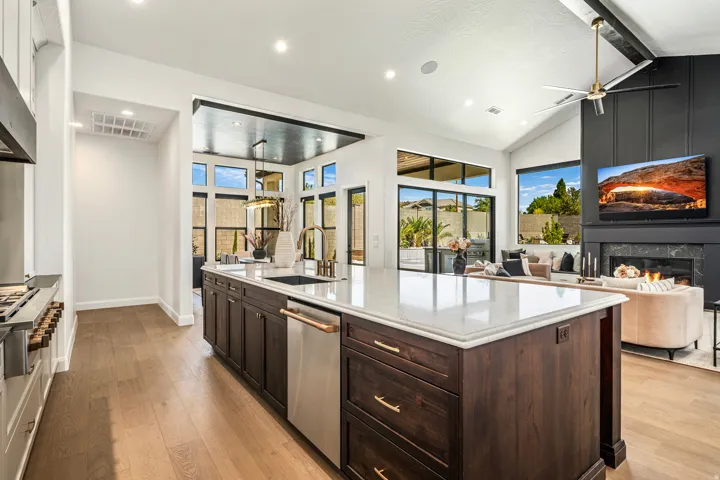 Spacious kitchen island with a white countertop and dark wood cabinetry