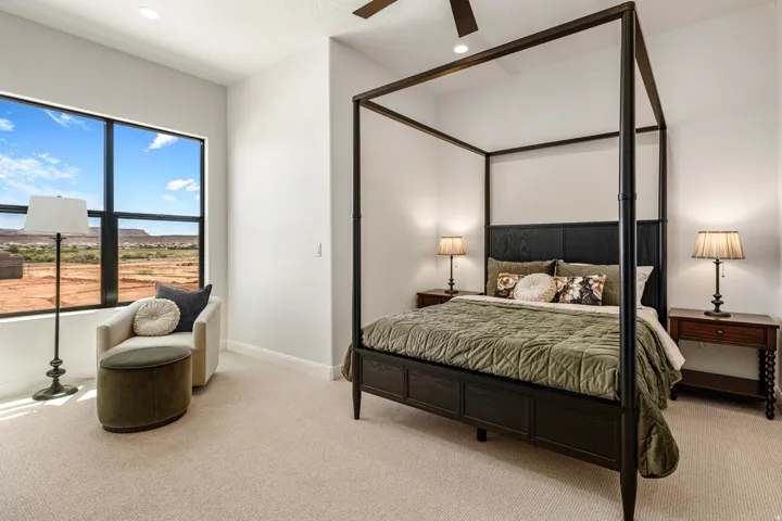 Spacious room featuring high ceilings and light-colored carpeting
