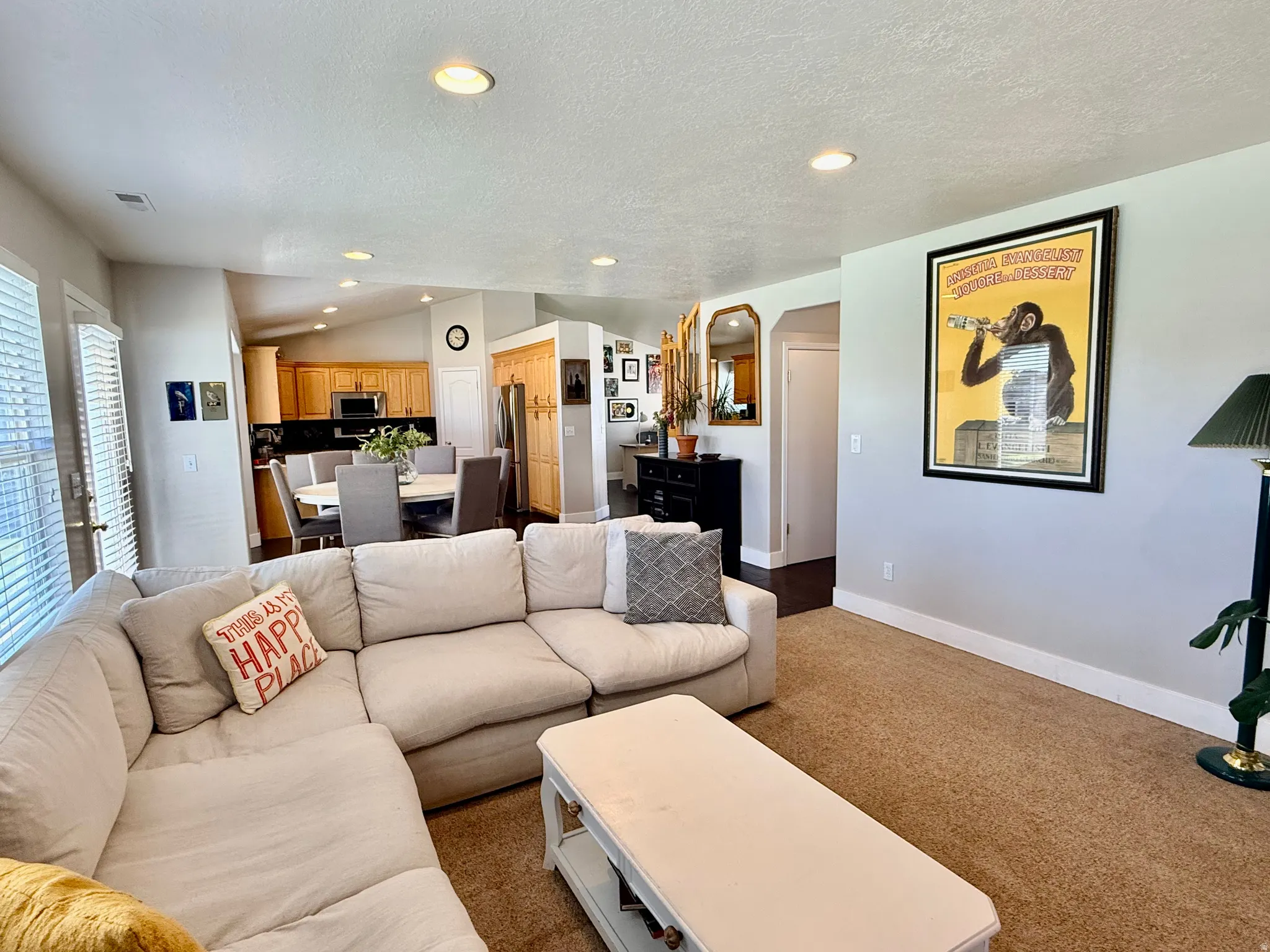 Living area featuring wall-to-wall carpeting and recessed lighting