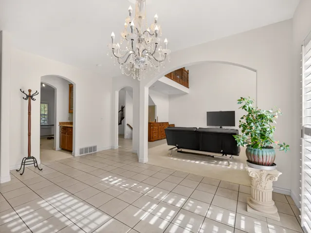 Entry foyer featuring a crystal chandelier