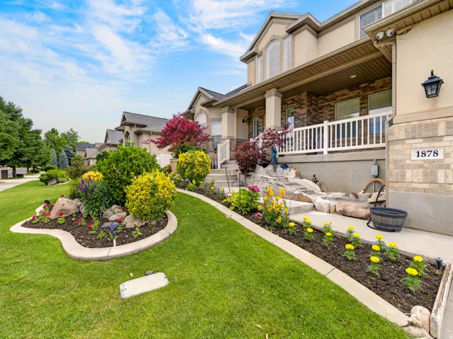 Crafted landscaping with stone accents and vibrant plantings