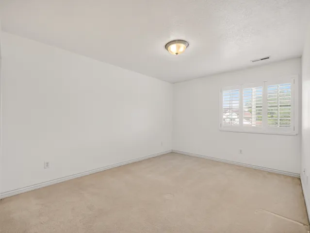 Neutral-toned carpeting paired with white walls