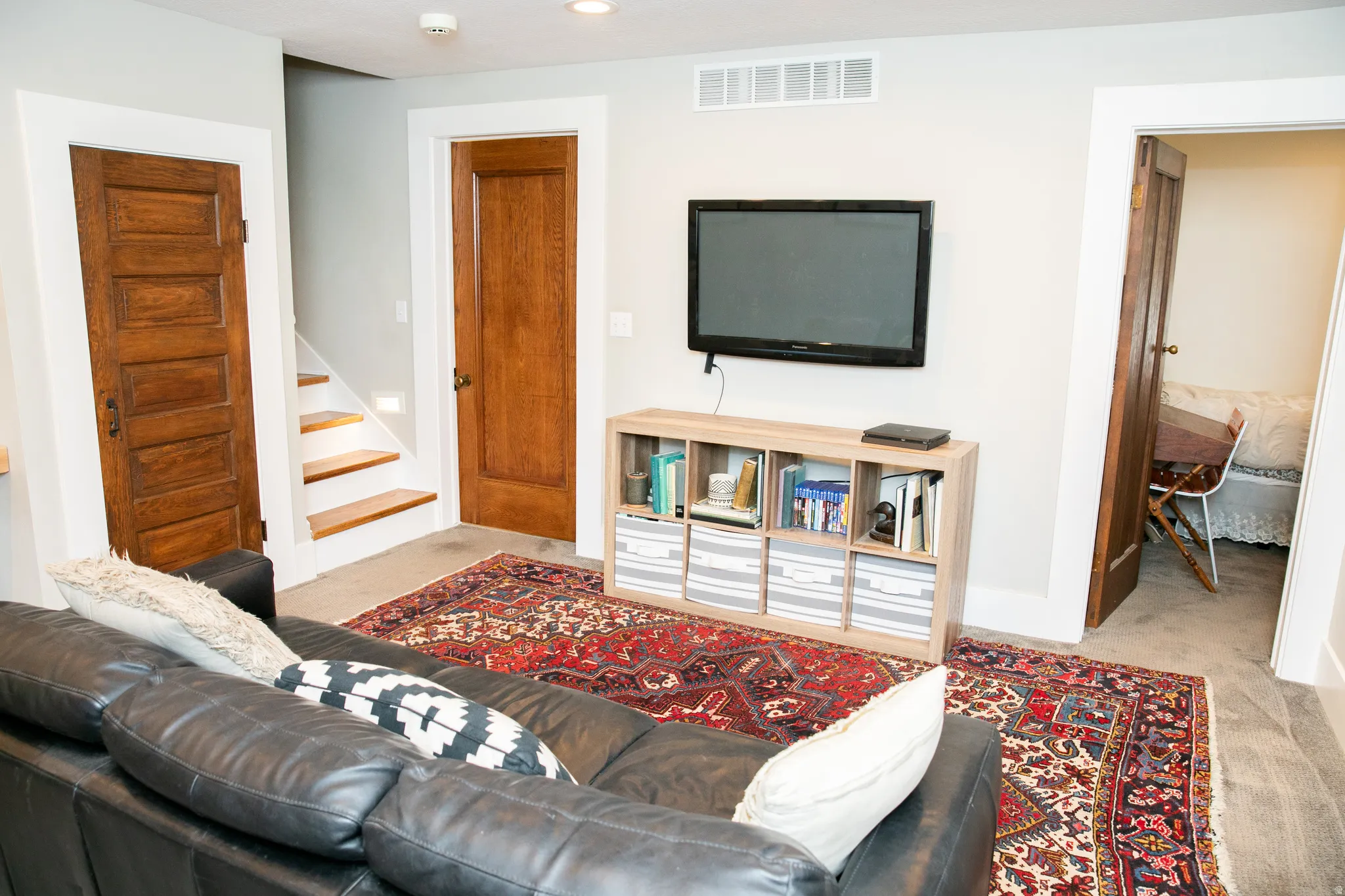 Recreational room with carpet flooring and light-toned walls