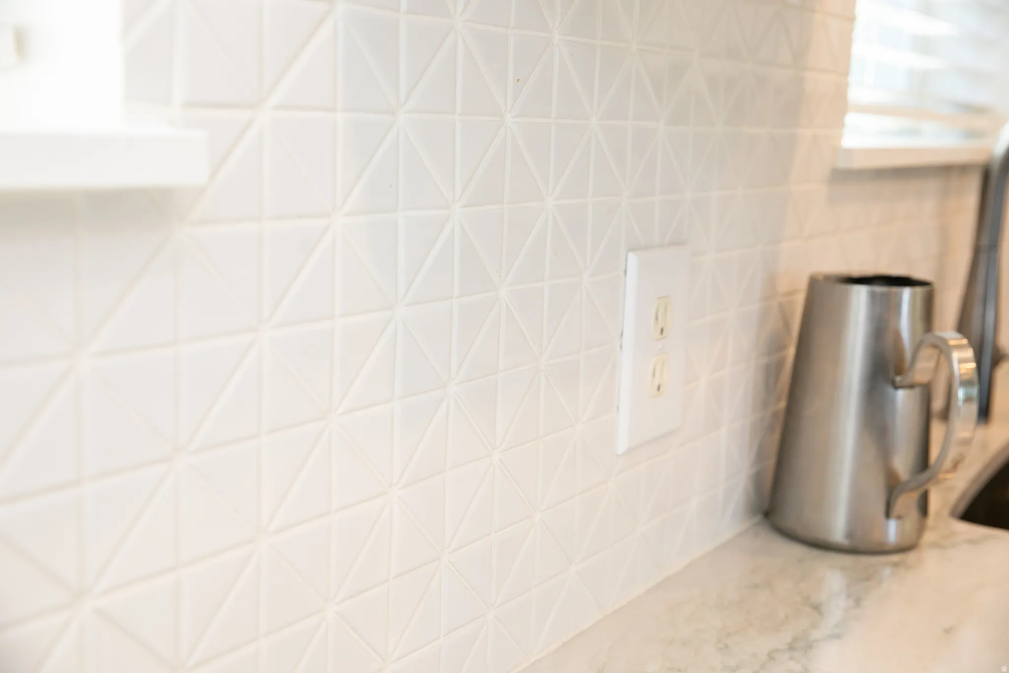 Textured geometric tile backsplash