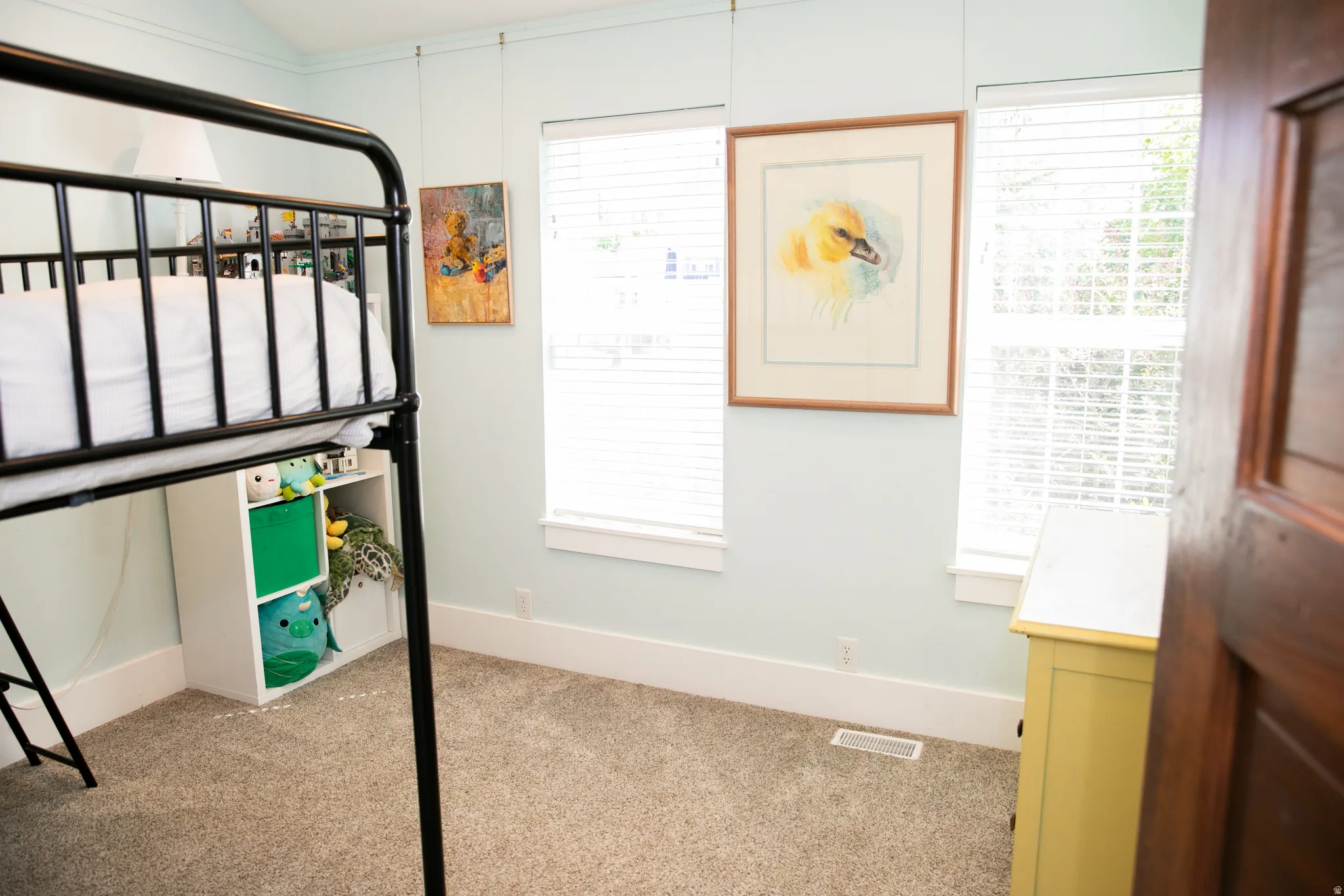 Light-colored walls complement the plush carpet flooring